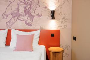 Postel nebo postele na pokoji v ubytování McDreams Hotel Wuppertal City