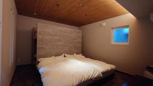 Postel nebo postele na pokoji v ubytování 柏屋旅館アネックス