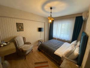 A bed or beds in a room at EVİM APART HOTEL