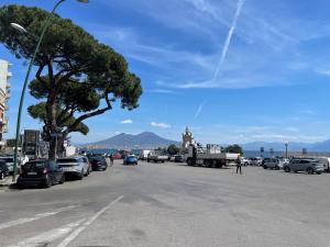 a street with cars parked on the side of the road at Casa Sermoneta in Naples