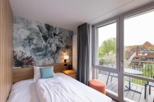 Voodi või voodid majutusasutuse Hotel Loge toas