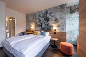 Voodi või voodid majutusasutuse Hotel Loge toas