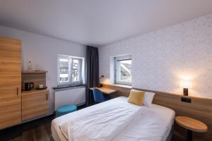 Voodi või voodid majutusasutuse Hotel Loge toas