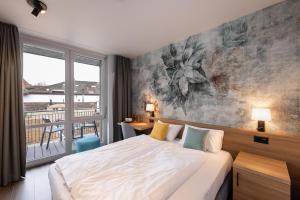 Ένα ή περισσότερα κρεβάτια σε δωμάτιο στο Hotel Loge +21 φωτογραφίες
