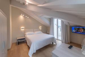 Posteľ alebo postele v izbe v ubytovaní Hotel Due Palme