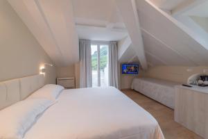 Posteľ alebo postele v izbe v ubytovaní Hotel Due Palme