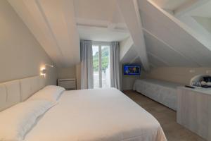 Posteľ alebo postele v izbe v ubytovaní Hotel Due Palme