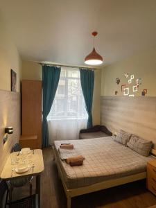 Posteľ alebo postele v izbe v ubytovaní Doba In Ua Studio Irpin Apartments