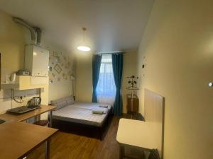 Posteľ alebo postele v izbe v ubytovaní Doba In Ua Studio Irpin Apartments