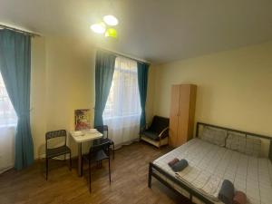Posteľ alebo postele v izbe v ubytovaní Doba In Ua Studio Irpin Apartments