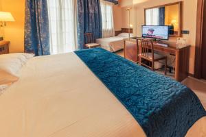 Postel nebo postele na pokoji v ubytování Hotel Bettina
