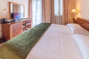 Postel nebo postele na pokoji v ubytování Hotel Bettina