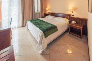 Postel nebo postele na pokoji v ubytování Hotel Bettina