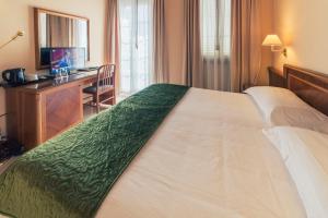 Postel nebo postele na pokoji v ubytování Hotel Bettina