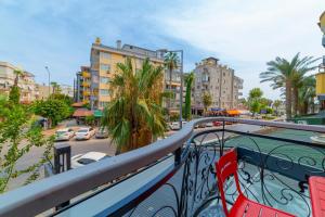 a balcony with a view of a street and buildings at Aria Riva Apart Hotel in Alanya
