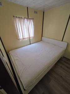Postel nebo postele na pokoji v ubytování caravan hereumond