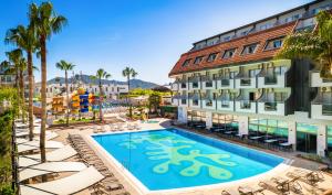 an image of a hotel with a swimming pool at Dedeman Kemer Resort - Ultra All Inclusive in Kemer