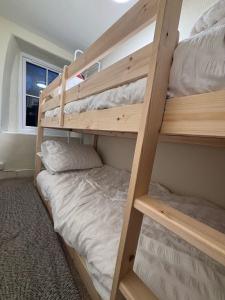 a couple of bunk beds in a room at The Cottage on the Rock in Barmouth