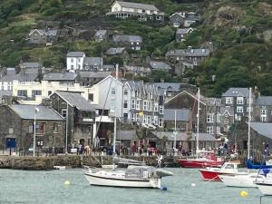a group of boats in the water in a harbor at The Cottage on the Rock in Barmouth
