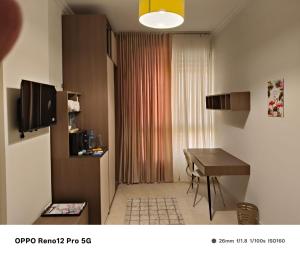 Μια τηλεόραση ή/και κέντρο ψυχαγωγίας στο غرف سنجل سكن العاصمة +11 φωτογραφίες