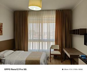 Ένα ή περισσότερα κρεβάτια σε δωμάτιο στο غرف سنجل سكن العاصمة