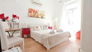 Posteľ alebo postele v izbe v ubytovaní KRLY Rooms Cagliari