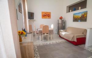 a living room with a couch and a table at Ciuri Ciuri in Isola delle Femmine