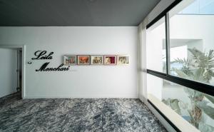 a white wall with a sign for a la miami museum at La Badira - Adult Only in Hammamet