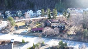 an aerial view of a village with houses and trees at Lite hus i hagen in Malvik