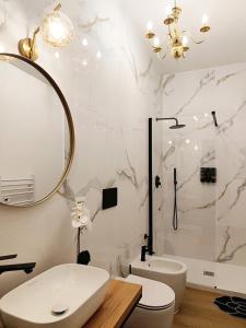 a bathroom with a sink and a mirror and a tub at Regina House al centro di Cagliari in Cagliari +32 photos