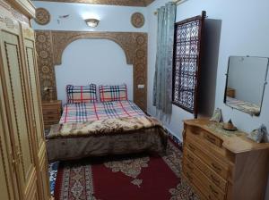 Postel nebo postele na pokoji v ubytování Riad Derb El Aarsa