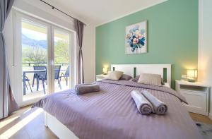 Ένα ή περισσότερα κρεβάτια σε δωμάτιο στο Apartments Ena & Leona