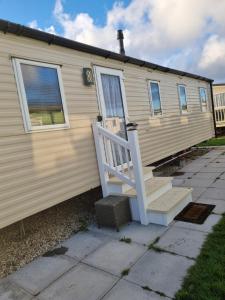 a house with a staircase on the side of it at fantasy island in Ingoldmells