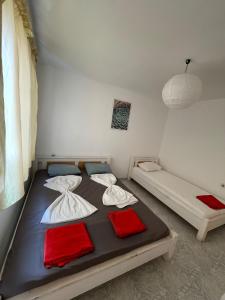 a bed in a room with two twin beds at Bonne Chance Apartment Sozopol in Sozopol