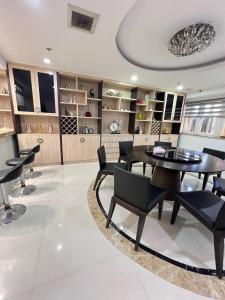a dining room with a table and chairs at R&R Entire Rental Unit in Manila +20 photos