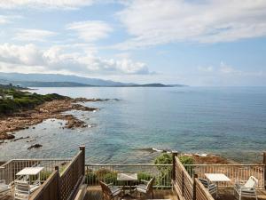 a view of the ocean from a balcony at Sofitel Golfe d'Ajaccio Thalassa Sea & Spa in Ajaccio