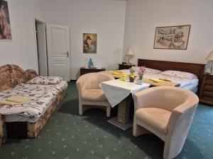 Posteľ alebo postele v izbe v ubytovaní Kristoff Plaza Trencianske Teplice