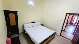 Postel nebo postele na pokoji v ubytování Hotel RJ INN
