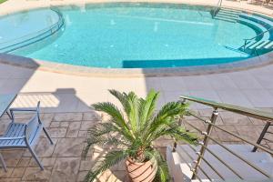 The swimming pool at or close to Luxury Suites in Stavromenos