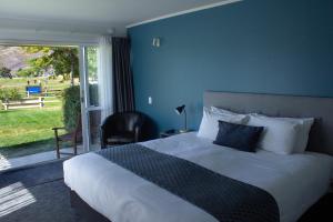 Voodi või voodid majutusasutuse Lake Dunstan Motel toas