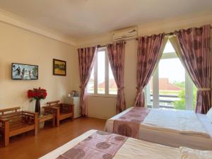 Letto o letti in una camera di Dai Long Hotel