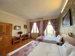 Letto o letti in una camera di Dai Long Hotel