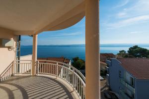 a balcony with a view of the ocean at Villa Belvedere in Lokva Rogoznica