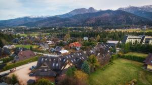 an aerial view of a village in the mountains at Sywarne, Sun & Snow in Kościelisko