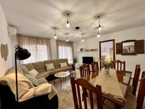 a living room with a couch and a table at ChicFlat Río Ciudad Real (Dúplex en el centro) in Ciudad Real