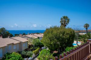 a view from the balcony of a resort with trees and a swimming pool at AT309 Con piscina a 5min playa in Altafulla