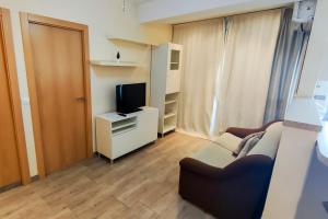 Televízia a/alebo spoločenská miestnosť v ubytovaní Apartamento super luminoso