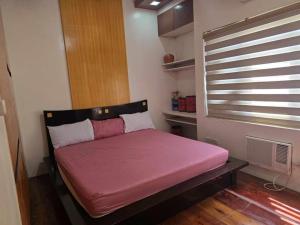 Katil atau katil-katil dalam bilik di Queen Isabel Private Villa and Events Place