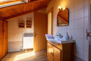 a bathroom with a sink and a mirror at Katouna Stone House in Katouna +31 photos