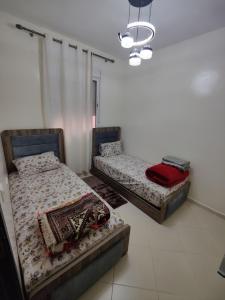 Postel nebo postele na pokoji v ubytování Dyour marjan